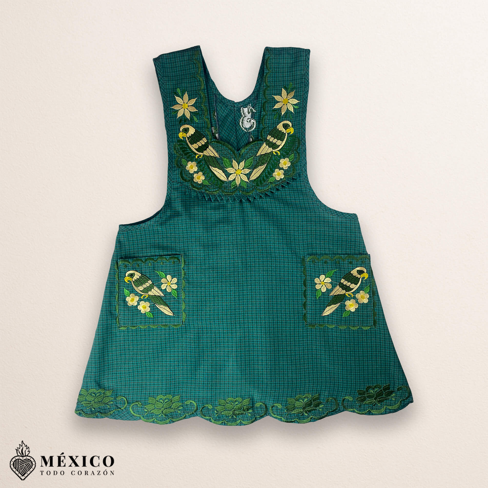 Green Mexican embroidered cotton apron featuring floral and bird motifs, perfect kitchen and cooking gift