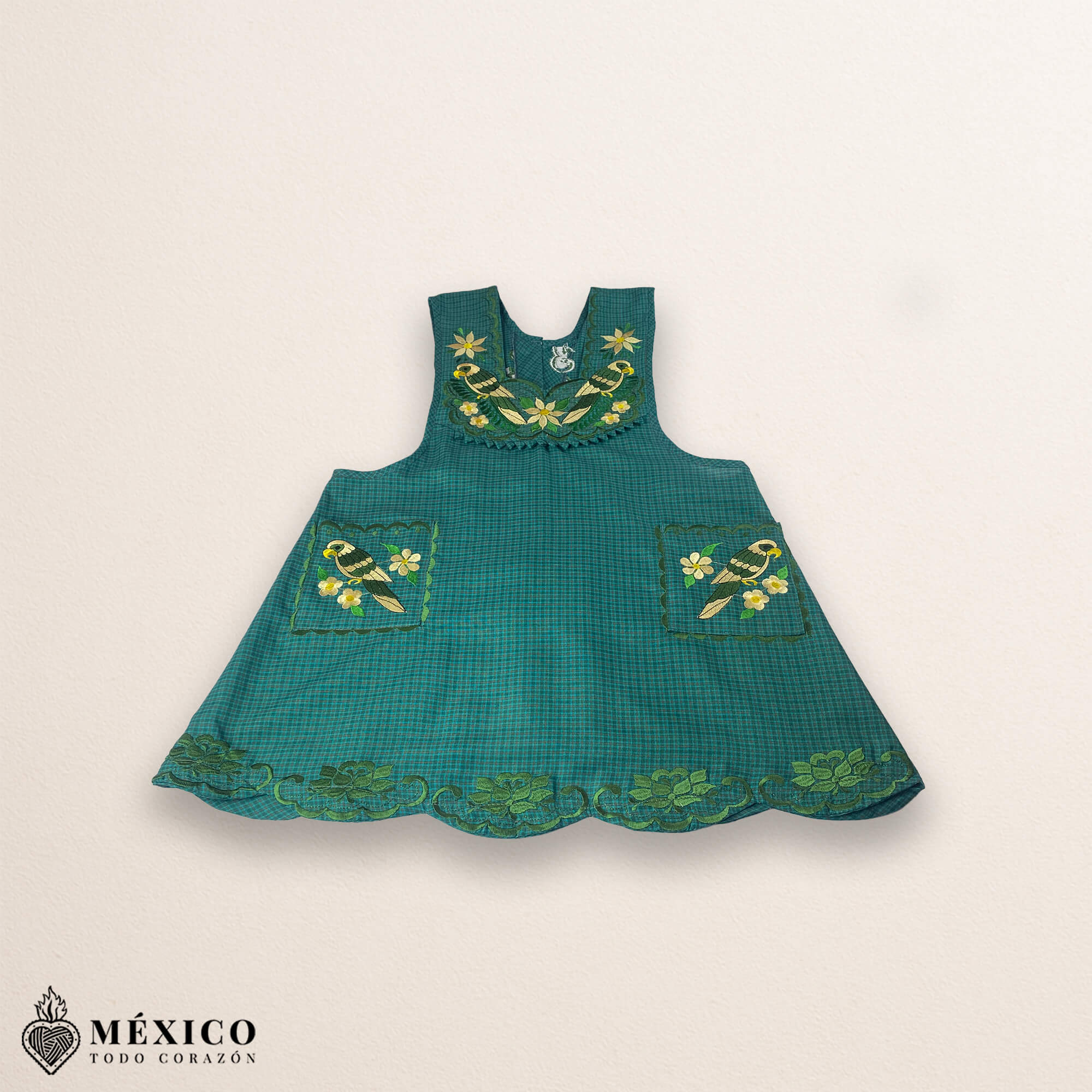 Green Mexican embroidered cotton apron featuring floral and bird motifs, perfect kitchen and cooking gift
