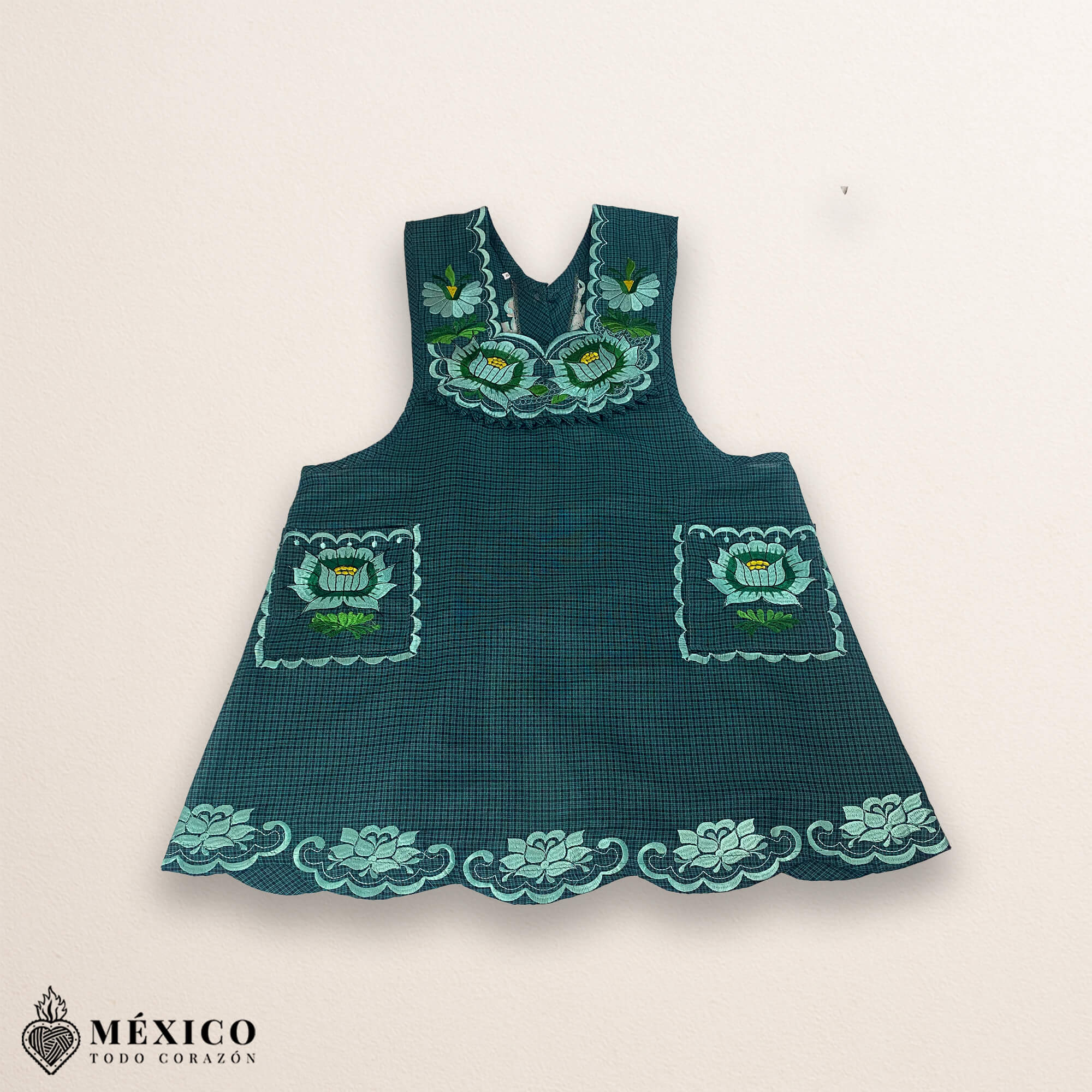 Mint green Mexican embroidered cotton apron featuring floral motifs, perfect kitchen and cooking gift