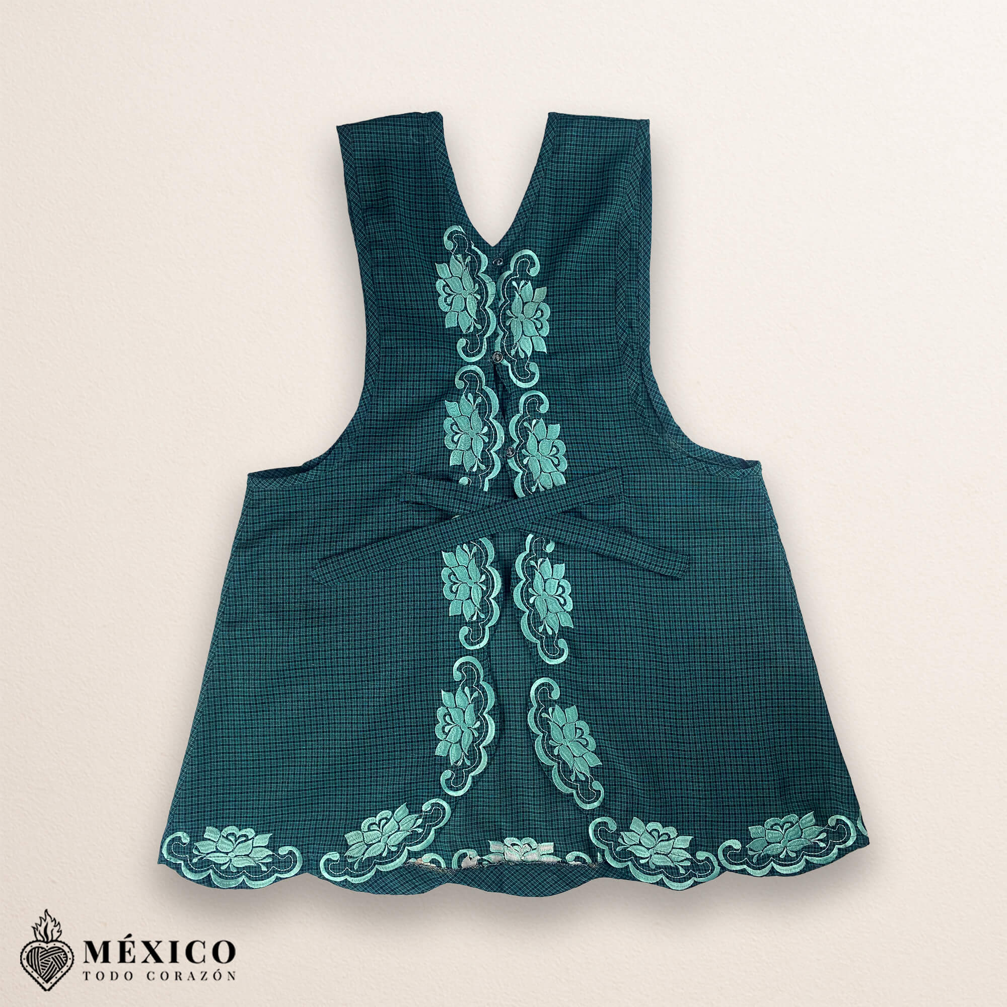 Mint green Mexican embroidered cotton apron featuring floral motifs, perfect kitchen and cooking gift
