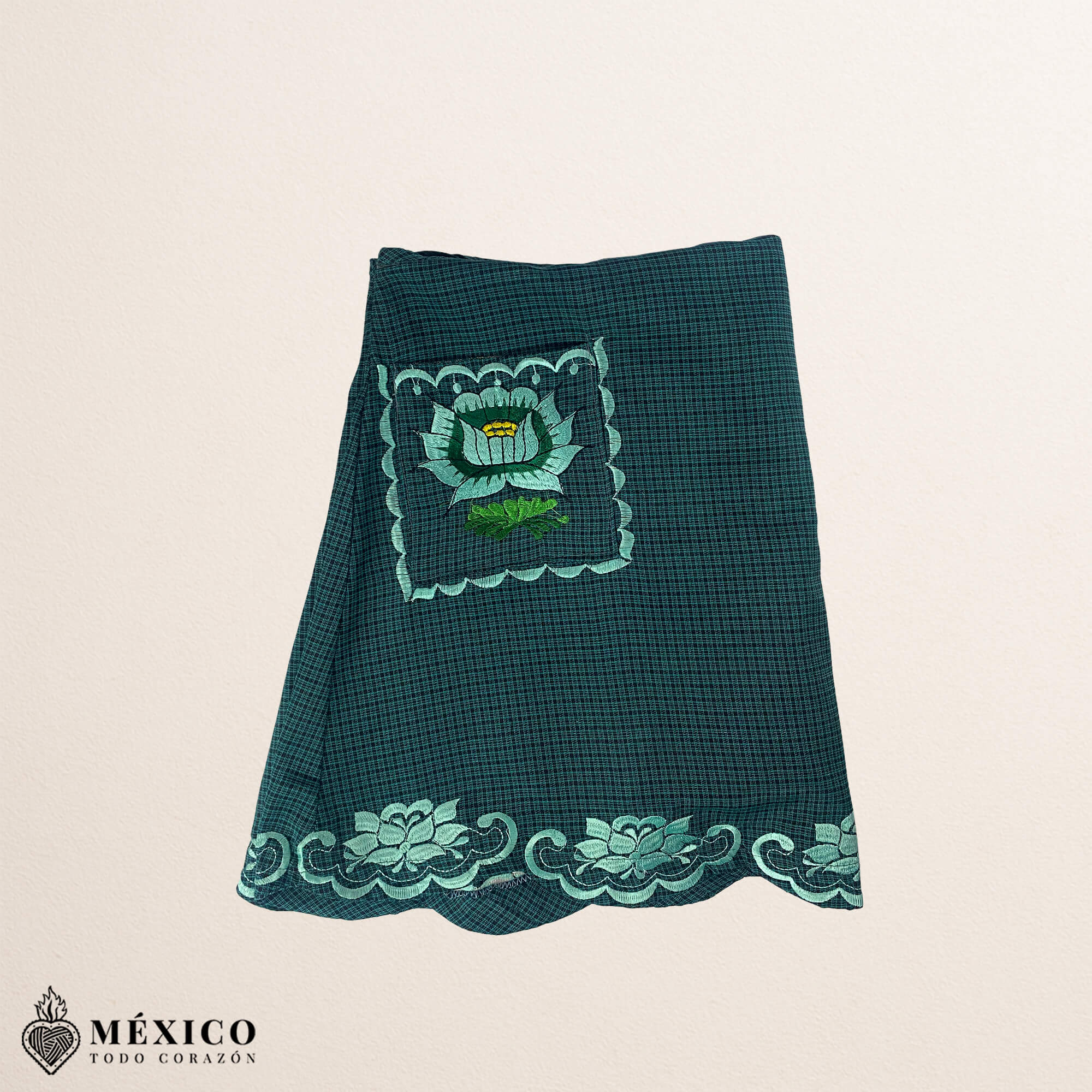 Mint green Mexican embroidered cotton apron featuring floral motifs, perfect kitchen and cooking gift