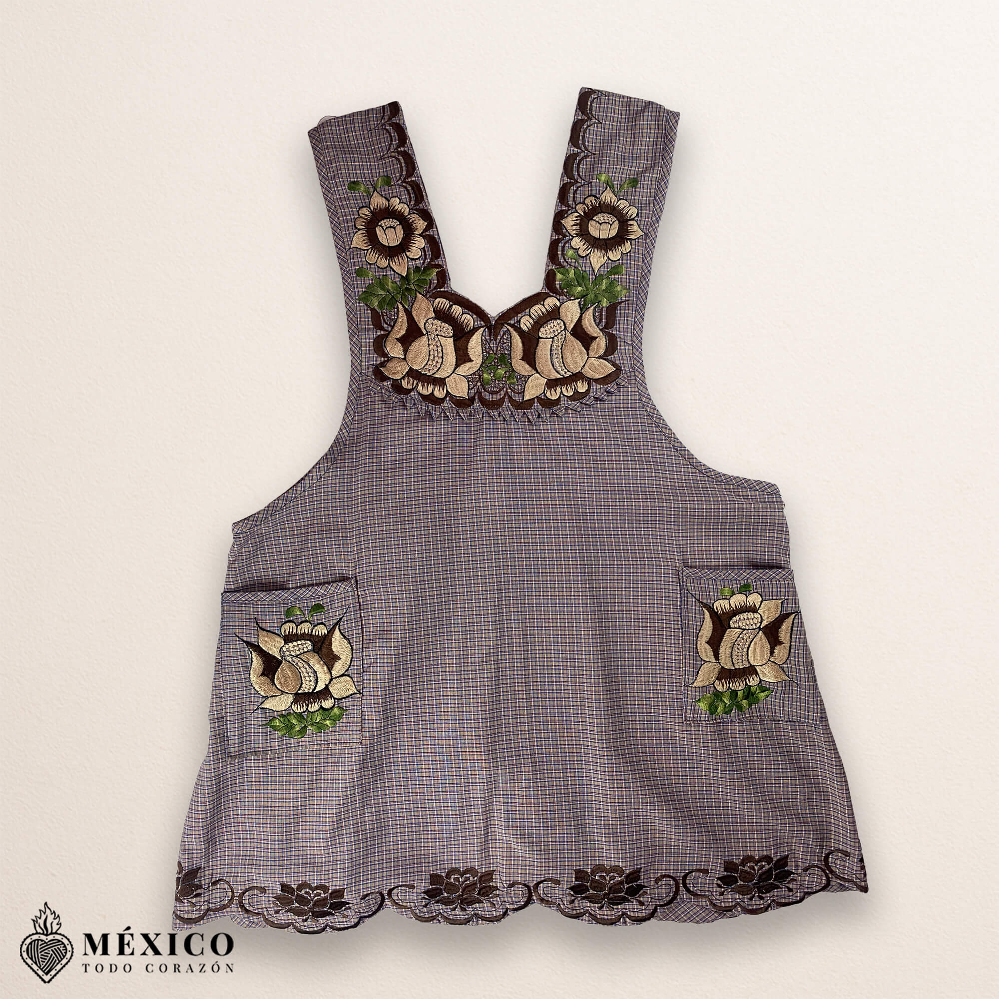 Light brown Mexican embroidered cotton apron featuring beige floral patterns, ideal kitchen and cooking gift.