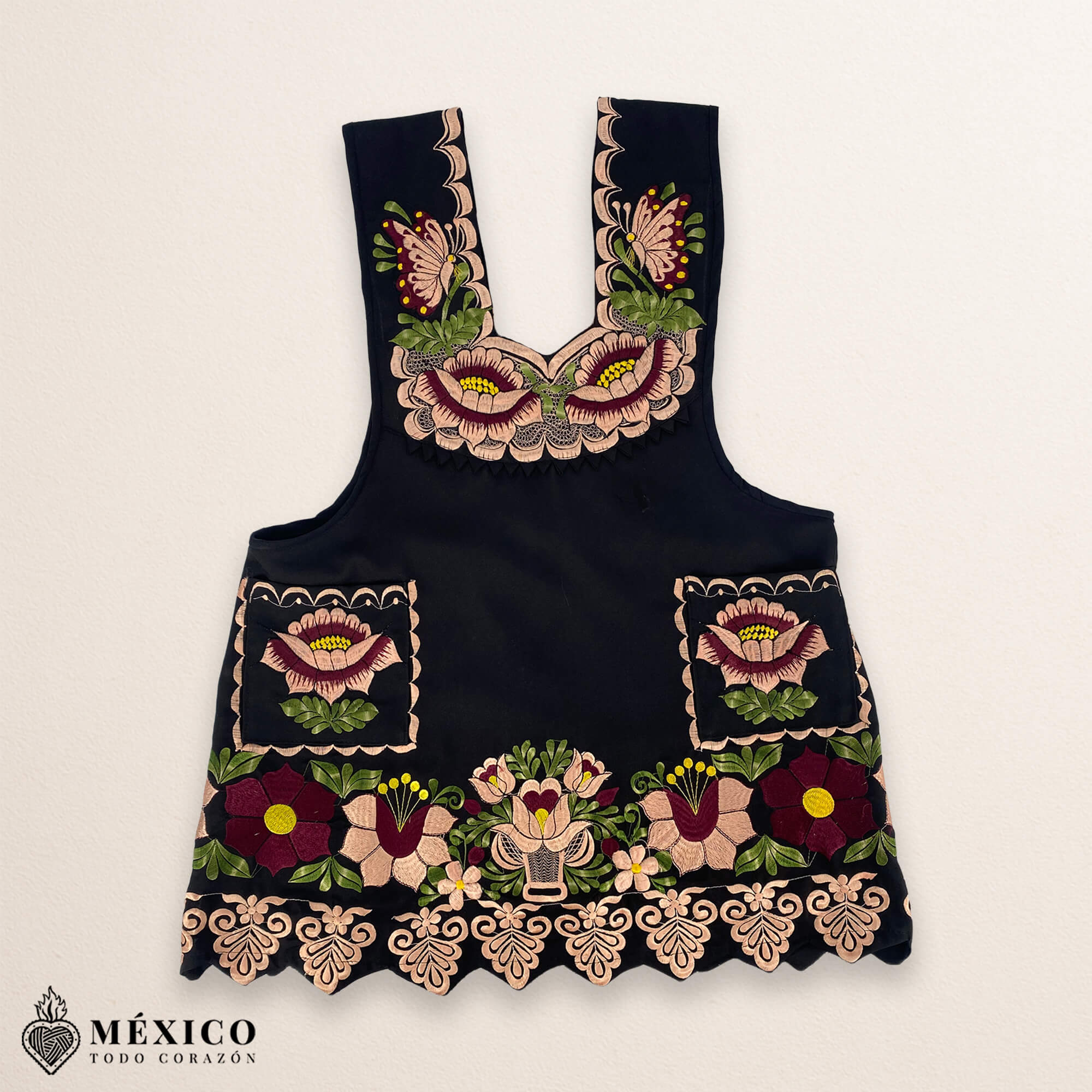 Black Mexican embroidered premium cotton blend apron featuring a beige floral design