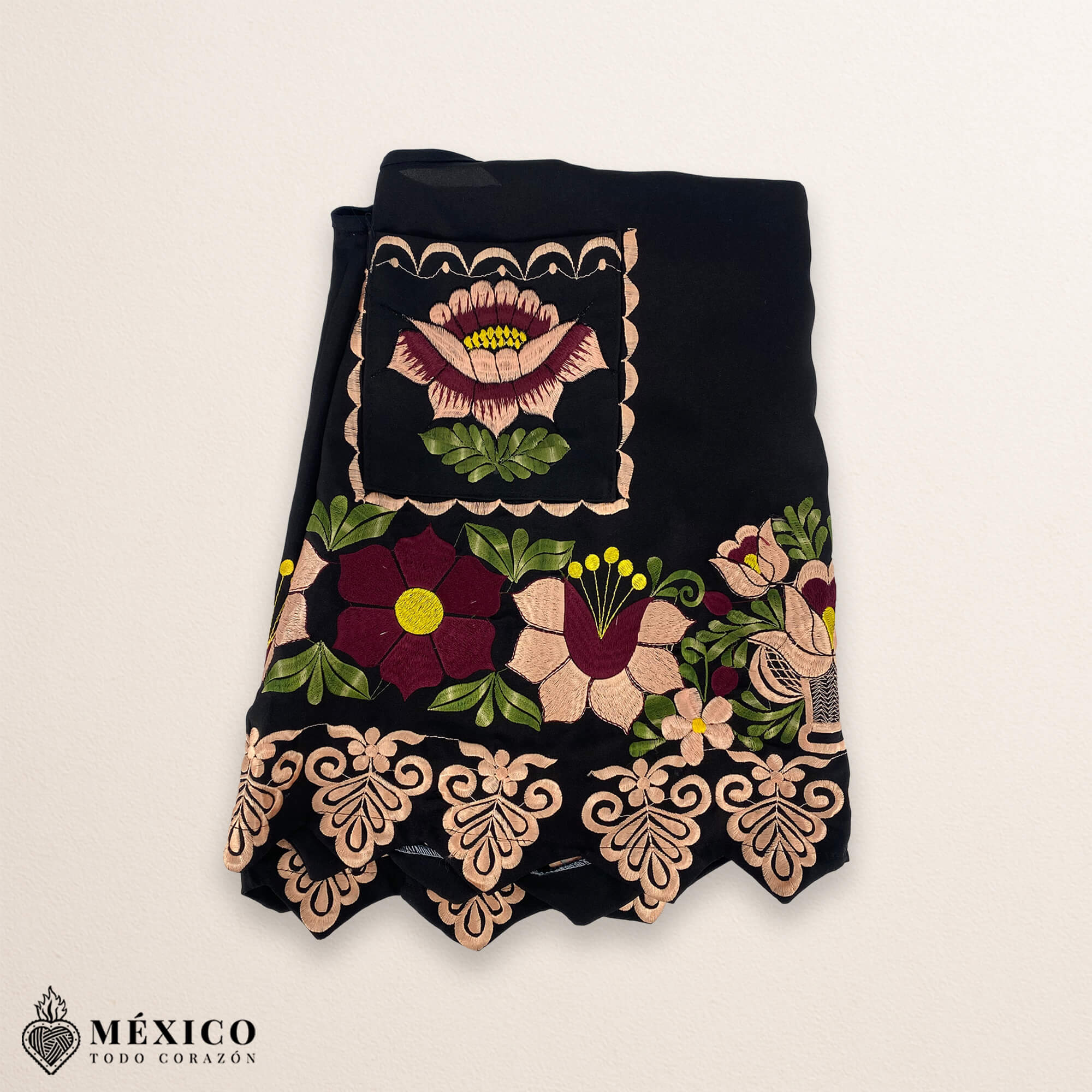 Black Mexican embroidered premium cotton blend apron featuring a beige floral design