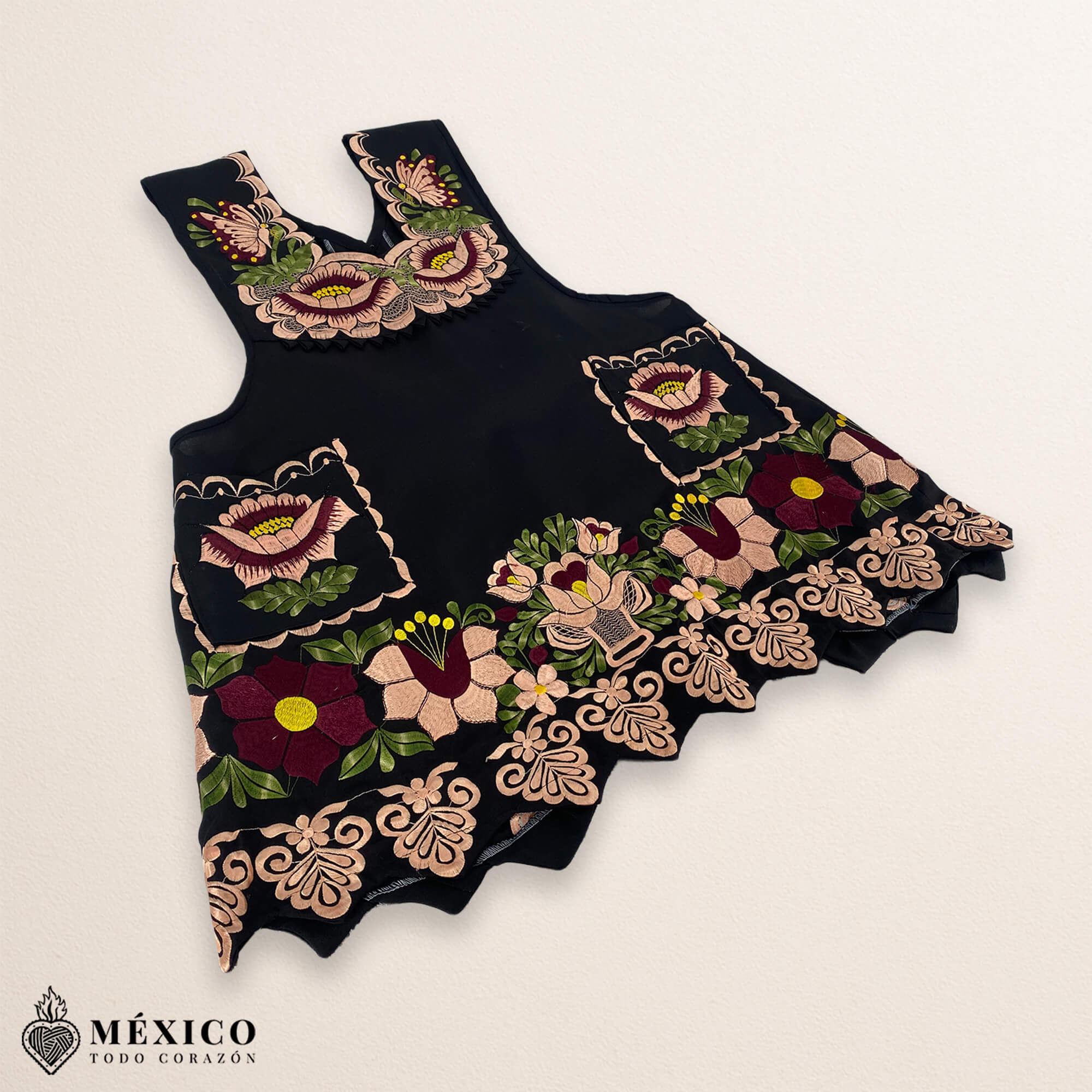 Black Mexican embroidered premium cotton blend apron featuring a beige floral design