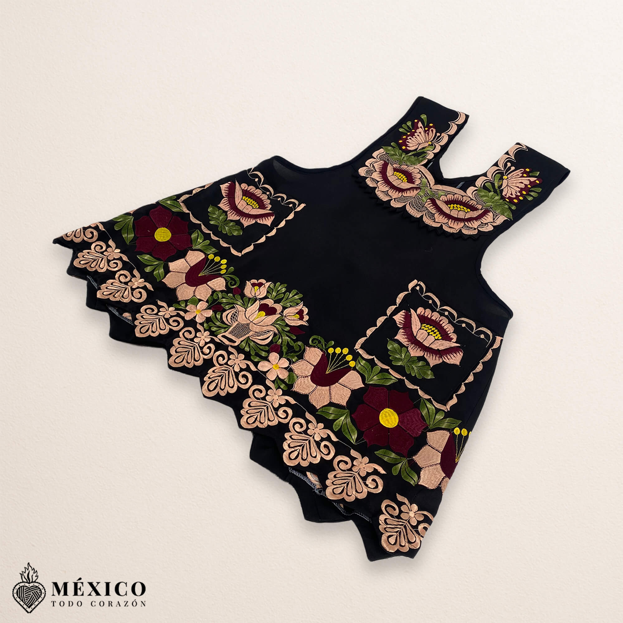 Black Mexican embroidered premium cotton blend apron featuring a beige floral design