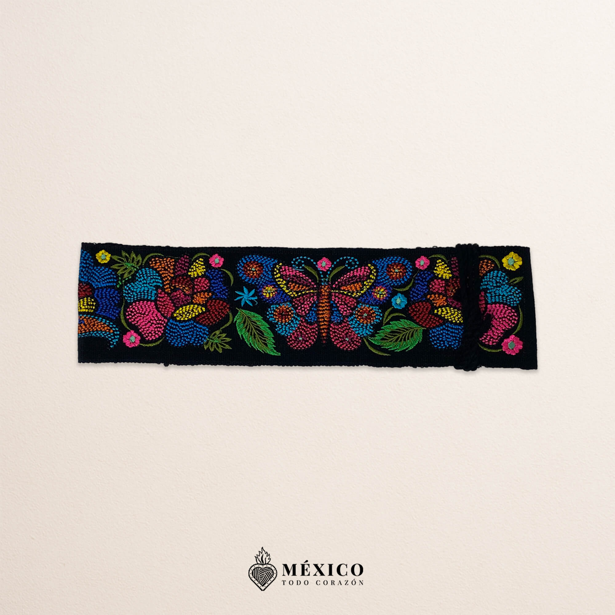 Black embroidered Mexican waist belt featuring a floral and butterfly design