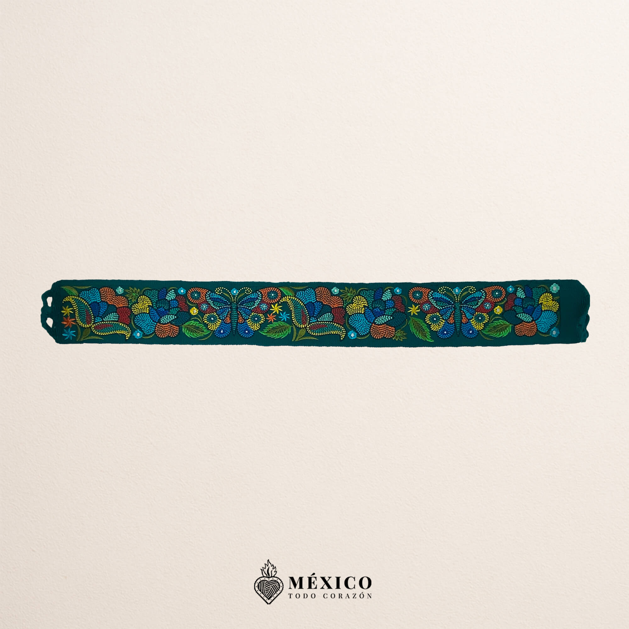 Turquoise embroidered Mexican waist belt featuring a floral and butterfly design