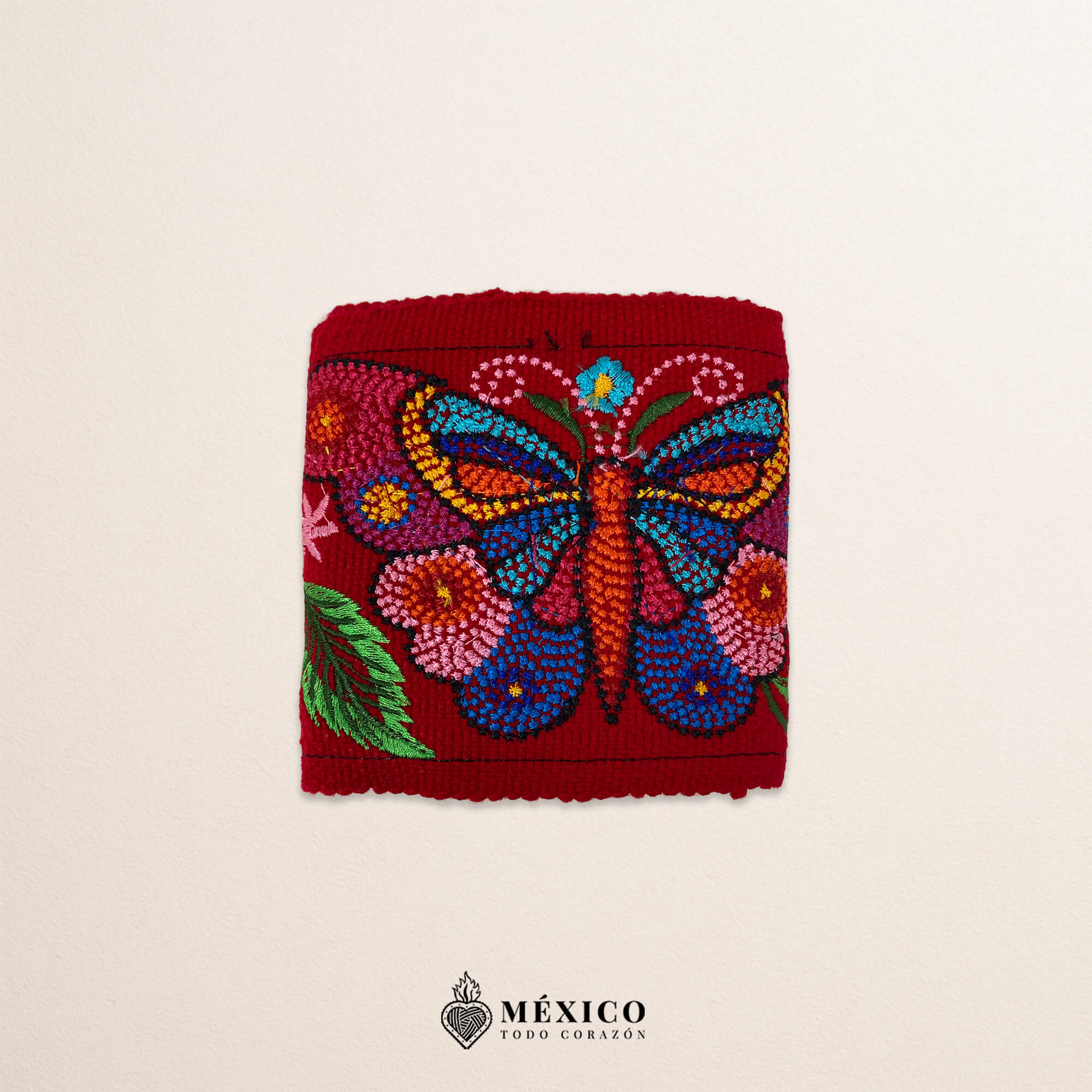 Red embroidered Mexican waist belt featuring a floral and butterfly design