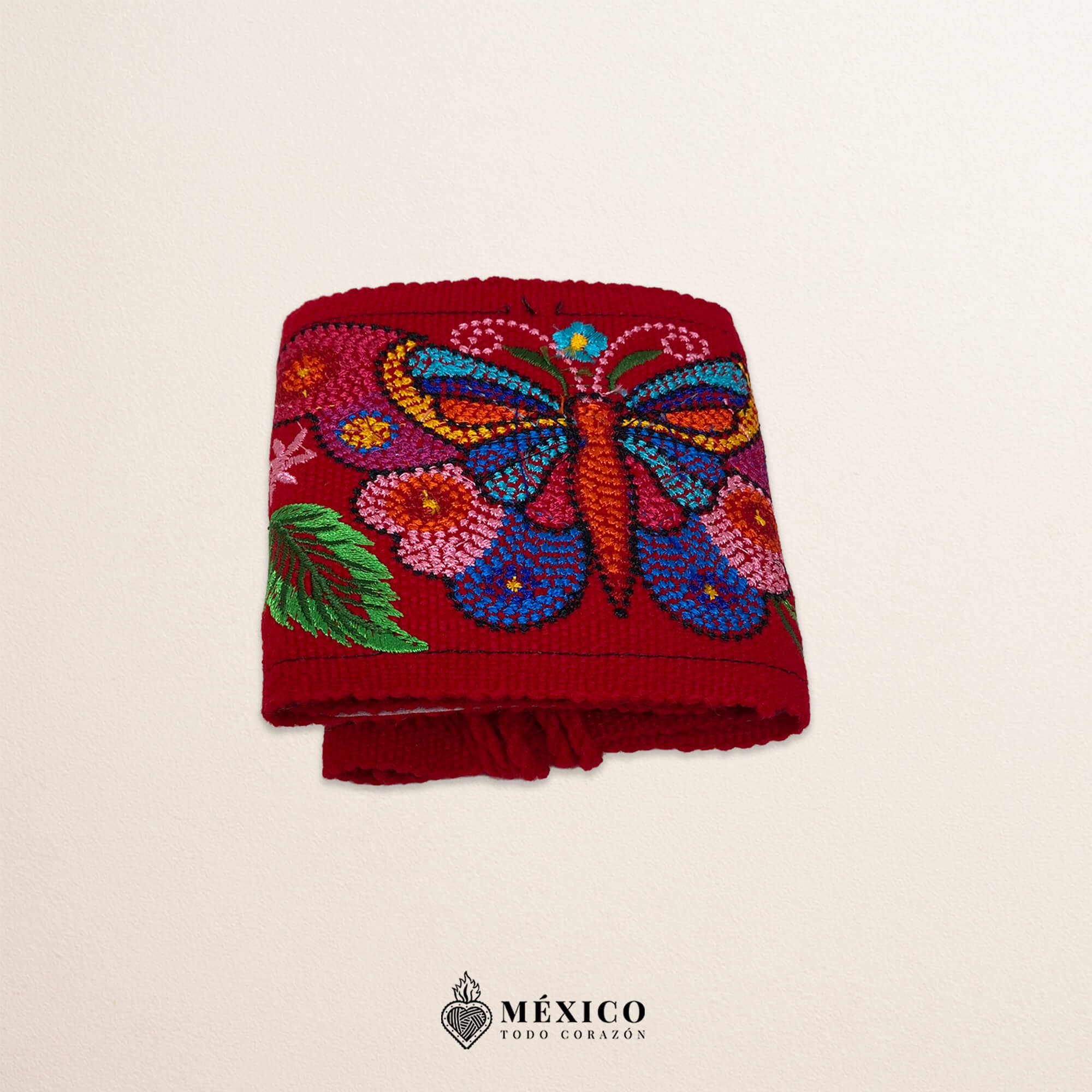 Red embroidered Mexican waist belt featuring a floral and butterfly design