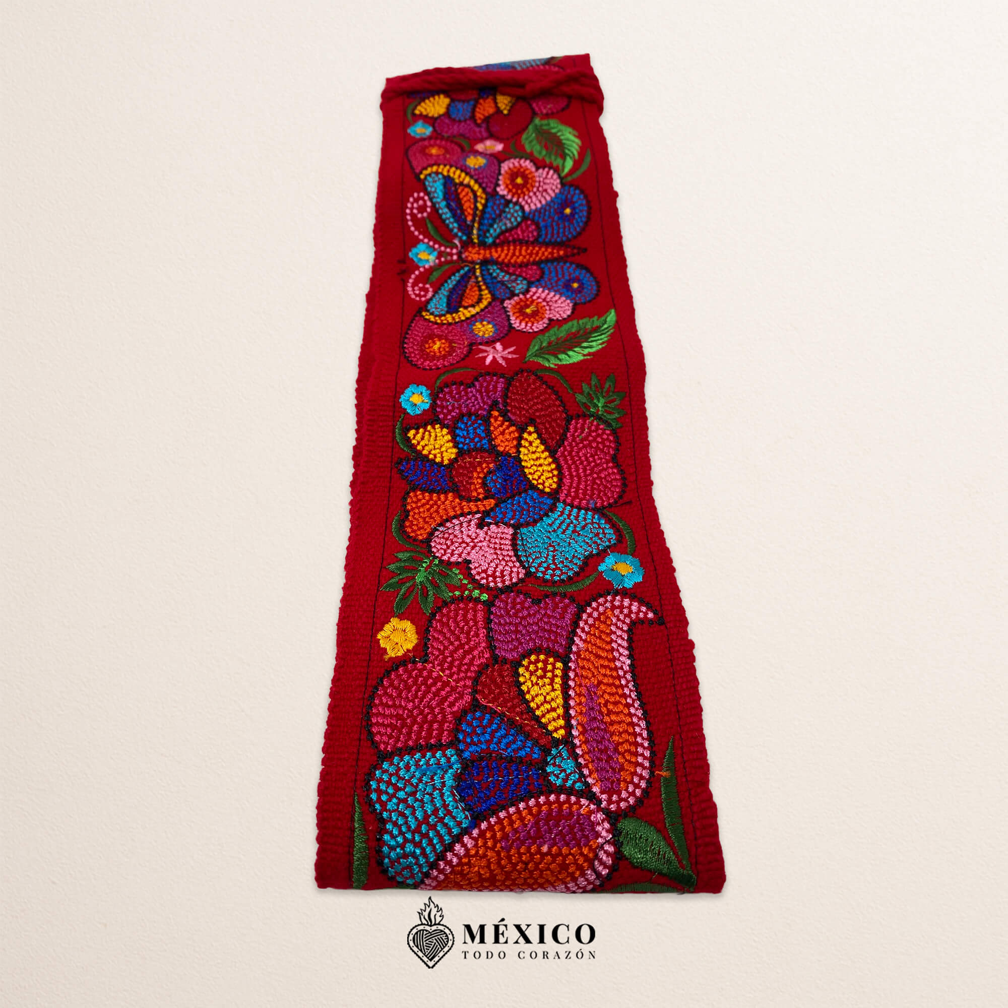 Red embroidered Mexican waist belt featuring a floral and butterfly design