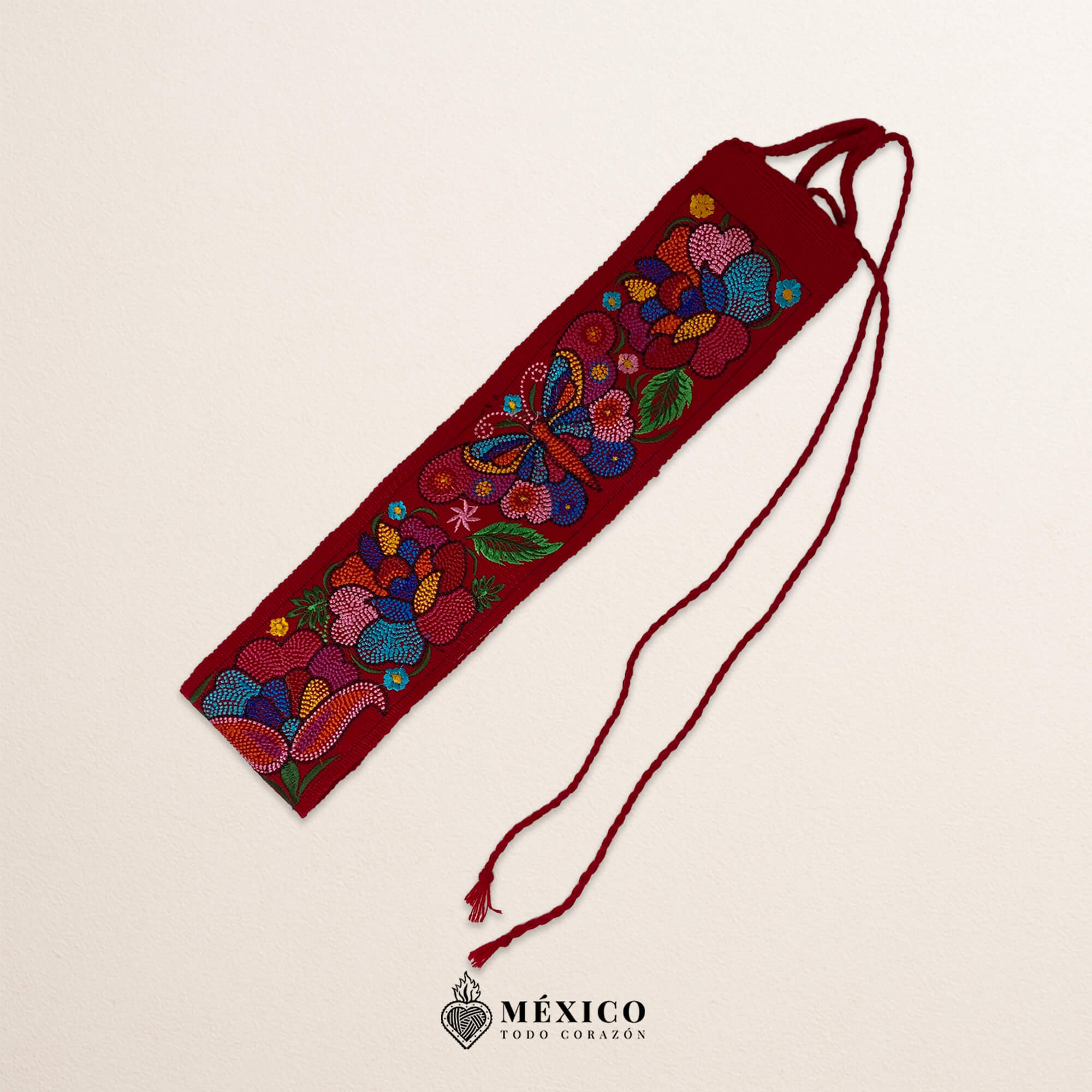 Red embroidered Mexican waist belt featuring a floral and butterfly design