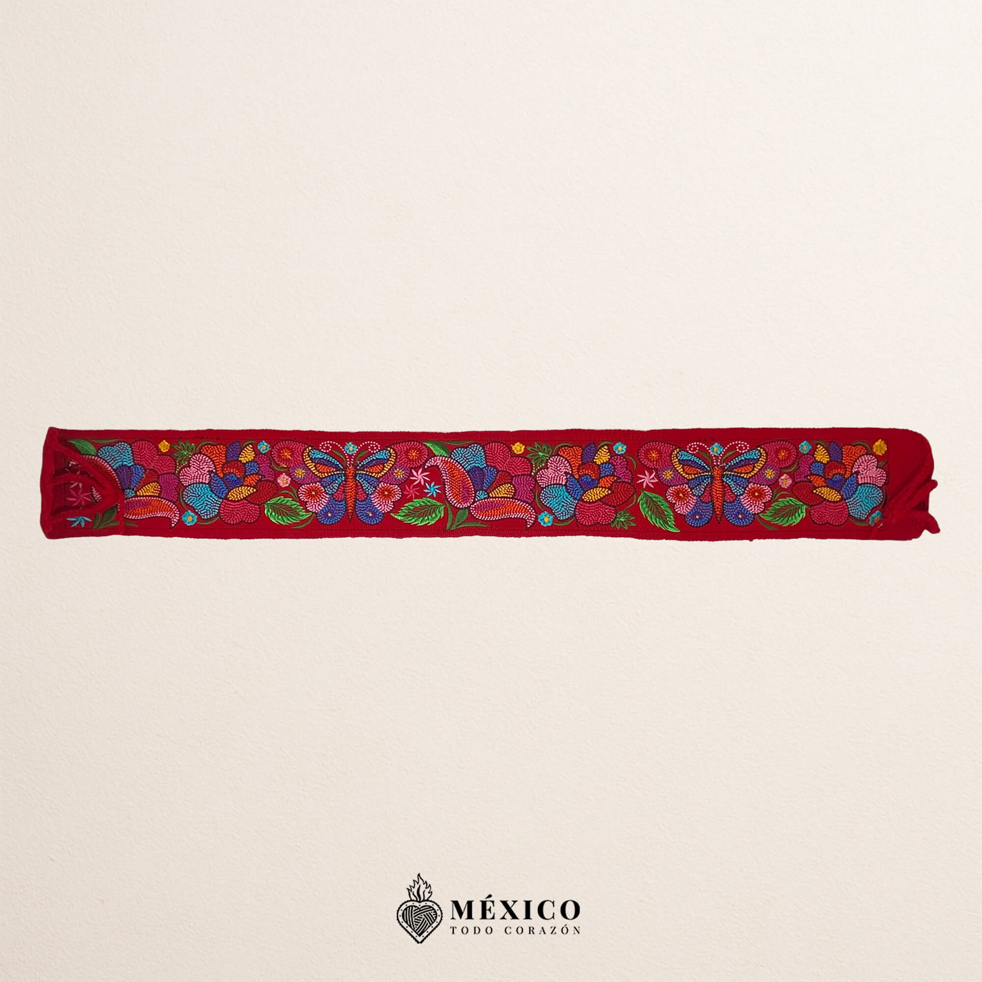 Red embroidered Mexican waist belt featuring a floral and butterfly design