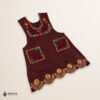 Red-brown Mexican embroidered apron with standard kitchen fit and detailed floral embroidery