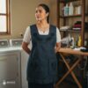 Black Mexican embroidered apron made of essential cotton, handmade kitchen apron featuring traditional floral embroidery inspired by Mexican craftsmanship