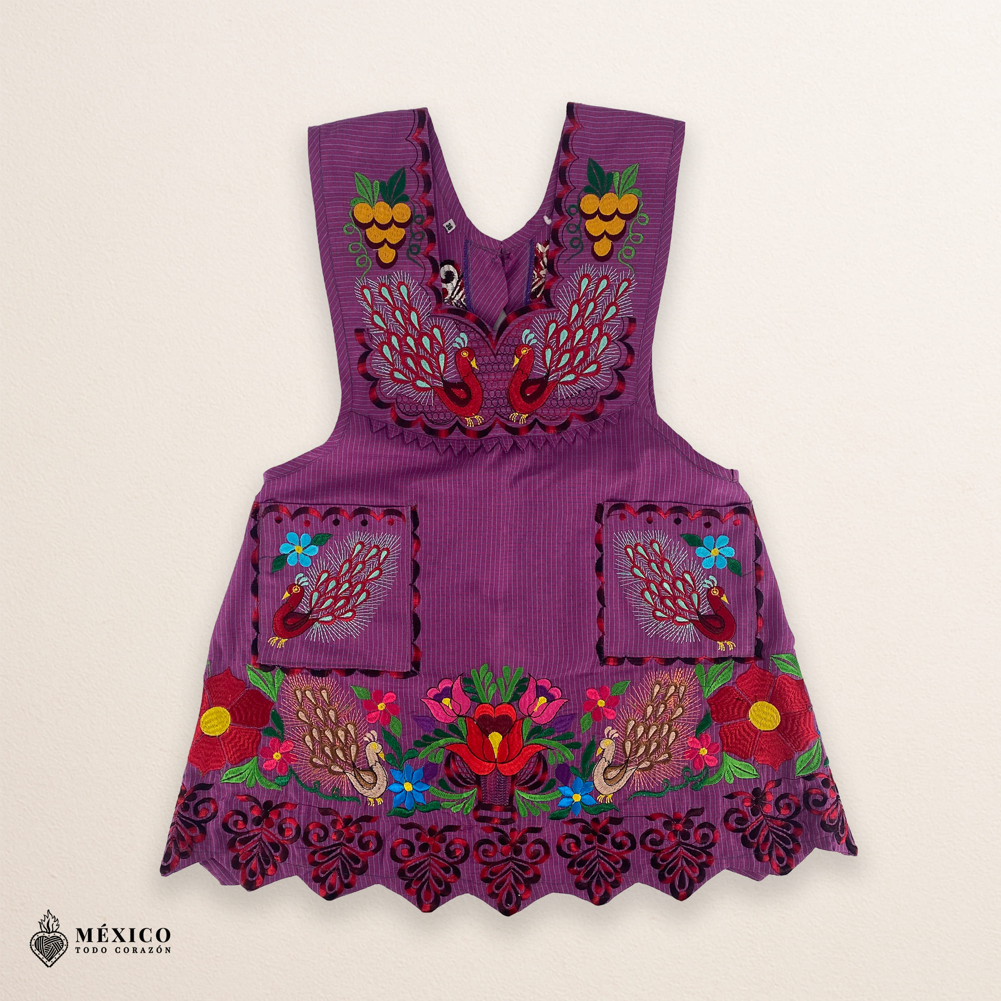 Cherry-colored Mexican embroidered apron crafted from premium cotton blend, featuring vibrant multicolor floral embroidery — traditional handmade kitchen apron inspired by Mexican culture