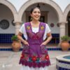 Cherry-colored Mexican embroidered apron crafted from premium cotton blend, featuring vibrant multicolor floral embroidery — traditional handmade kitchen apron inspired by Mexican culture
