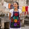 Mexican embroidered bib apron for women in multicolor cotton fabric, featuring vibrant floral design — handmade traditional kitchen apron perfect for cooking, gifts, and cultural celebrations.
