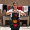 Mexican embroidered bib apron for women in multicolor cotton fabric, featuring vibrant floral design — handmade traditional kitchen apron perfect for cooking, gifts, and cultural celebrations.